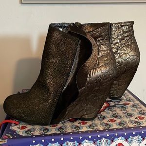 Irregular Choice heeled shimmer booties with patent side flap detail.